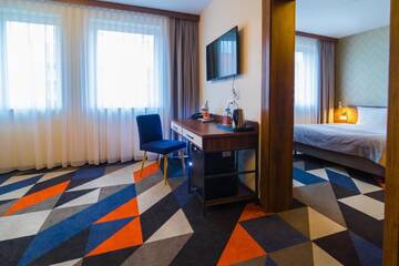 Фото номера Улучшенный четырехместный номер Отель Vulcan Hotel г. Щецин 9
