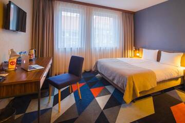 Фото номера Улучшенный четырехместный номер Отель Vulcan Hotel г. Щецин 8