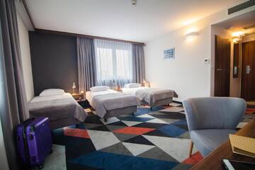 Фото номера Трехместный номер Отель Vulcan Hotel г. Щецин 3