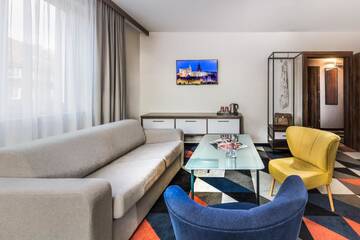 Фото номера Улучшенный четырехместный номер Отель Vulcan Hotel г. Щецин 4