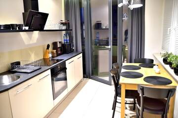 Фото номера Апартаменты с балконом Апартаменты TOP Apartments 2 г. Щецин 3
